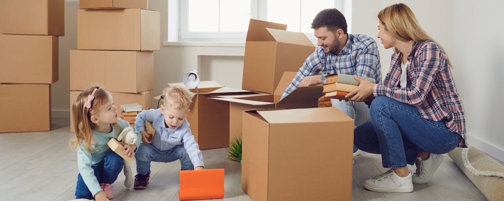 Packing supplies like tape, bubble wrap, and a box cutter.